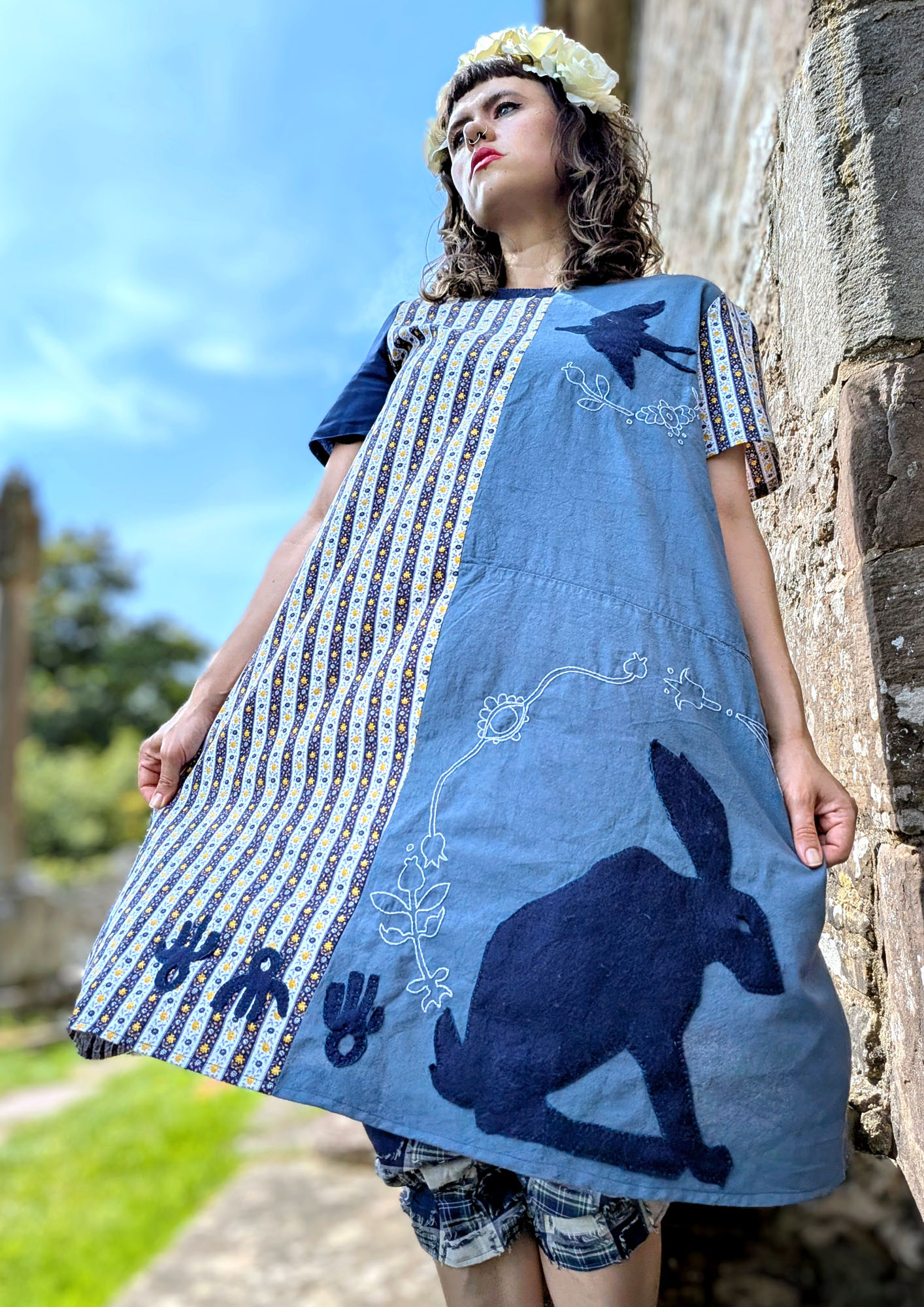 Blue dress portrait three-quarter